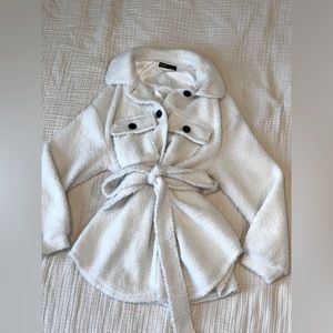 White fuzzy medium length winter coat